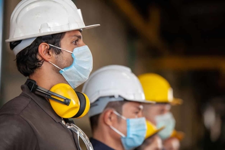 Construction Workers with Helmets and Masks